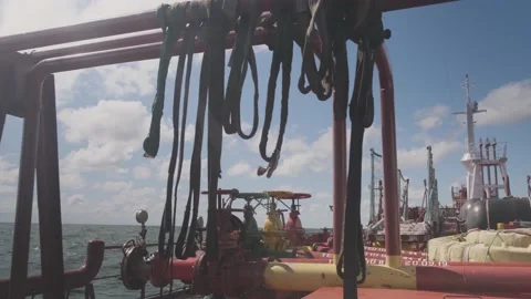 Black ropes waved by wind on large oil tanker deck closeup Stock Footage 147171550