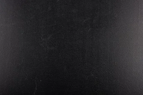 Black rough plastic surface with regular artificial pimply bumps Stock Photos