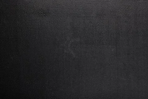 Black rough plastic surface with regular artificial pimply bumps Stock Photos