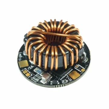 Black round led driver PCB board with inductance coil and surface mount compo Stock Photos