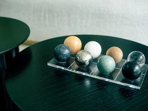 Black round table features a clear acrylic tray Stock Photos
