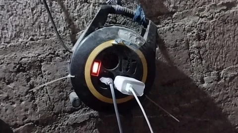 This black roundabout electrical terminal has been in use for a very long time Stock Footage 225180199