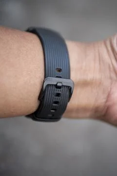 Black rubber watch strap weared by Asian men Stock Photos