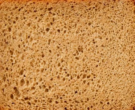 Black rye bread texture background. Top view. Food concept. Design element. Stock Photos