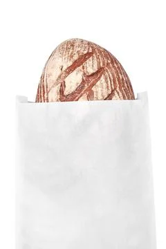 Black rye bread in a white paper bag. Foto stock