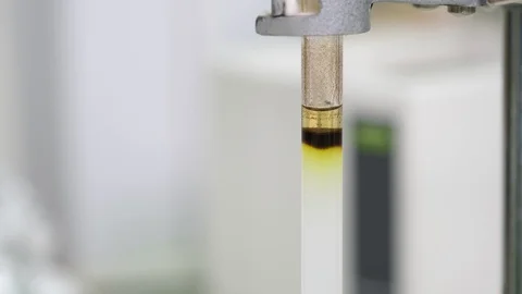 Black sample was added into a glass column and used solvent to elute the sample Stock Footage 129827479