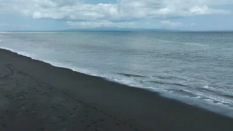 Black sand beach and rough sea waves Stock Footage 252977841
