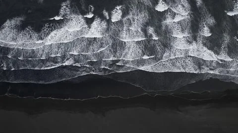 Black sand beach Stock Photos