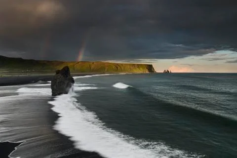 Black Sand Beach Reynisfjara in Iceland. Windy Morning. Ocean Waves. Colorful Stock Photos