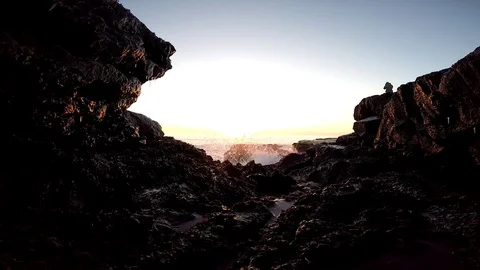 Black sand beach ,Rocks and cliffs at ocean beach. Snowy beach of Iceland. Stock Footage 118241942