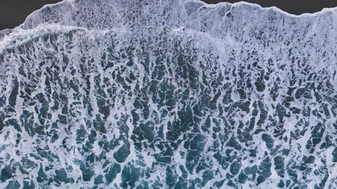 Black sand beach with white foam waves Atlantic Ocean Видео 320015534