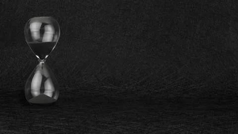 Black sand clock timer hourglass on black textured background. Stock Photos