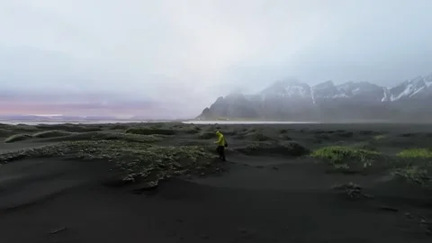 Black sand dunes with moss texture and sunset silhouette circling movement Stock Footage 341607285