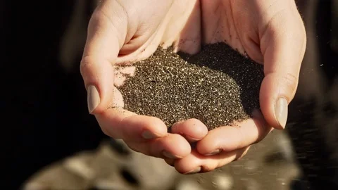 Black sand falling from hands 스톡 동영상 106061148