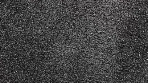 Black Sandpaper Texture loop. Rough Grit Abrasive Background. Grain Emery B.. Stock Footage 223761020