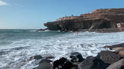 Black sandy beach and pebbles at Ajuy Fuerteventura Stock Footage 239928251