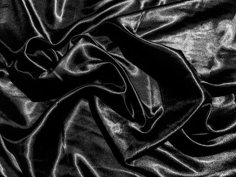 Black satin texture background with liquid wave or wavy folds. Wallpaper desi Foto stock