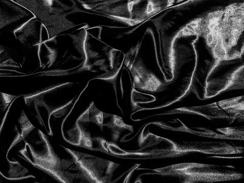 Black satin texture background with liquid wave or wavy folds. Wallpaper desi Stock Photos
