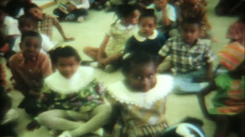 Black school children sit on the floor in classroom 1950s family home movie 7089 Stock Footage 201220692