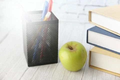Black to school concept with apple on notepad on table. 写真素材