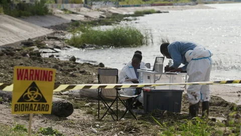 Black Scientists Analyzing Water Samples in Biohazard Zone Stock-Footage 344720998