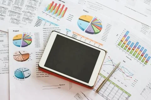 Black screen tablet with analysis project financial chart  document Stock Photos