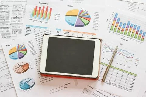 Black screen tablet and pie chart to show financial business report Stock Photos