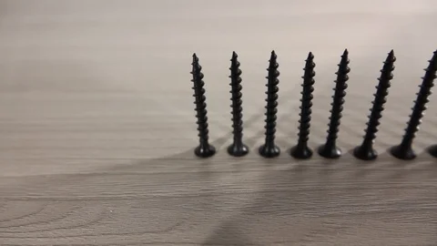 Black Screws are on the table Stock Footage 103856924