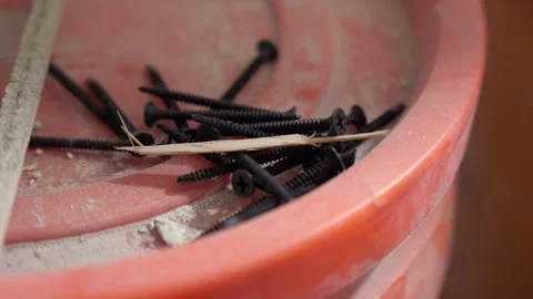 Black Screws on Construction Bucket Lid Stock Footage 313849751