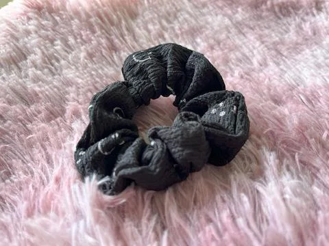Black Scrunchie on Soft Pink Background Stock Photos