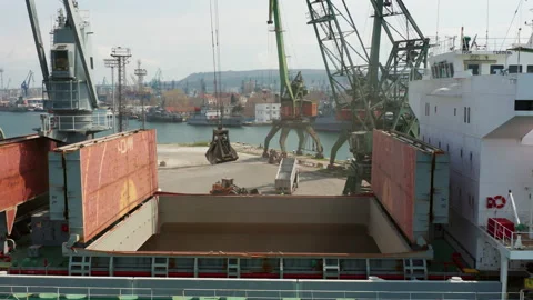 Black Sea port Loading of dry cargo ship by grain cranes. Maritime grain export Stock Footage 237826436