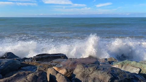 Black Sea waves breaking, wide view along the rocky Batumi shore Stock Footage 345361584