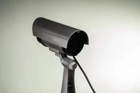 Black security camera on a stand with curved top Stock Photos