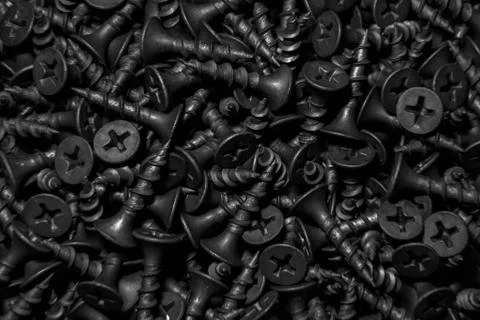 Black self-tapping screws Stock Photos