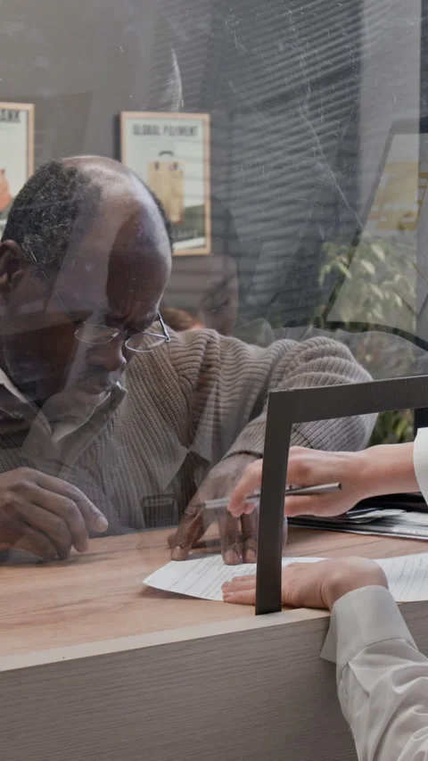 Black Senior Customer Completing Documents in Bank Stock Footage 331506740