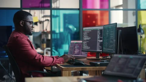 Black Senior Developer Coding On Computer In Office Stock Footage 223192491