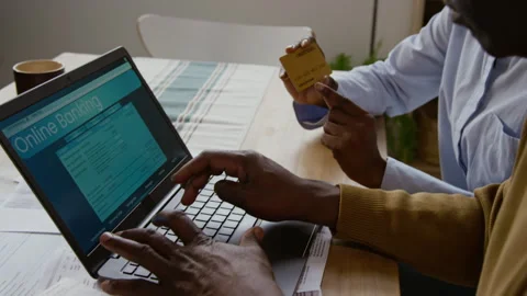 Black Senior Man using Banking Website Hands Typing on Laptop Keyboard Stock Footage 327684500