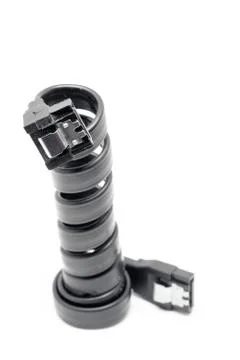 Black Serial-ATA cable on white. Stock Photos
