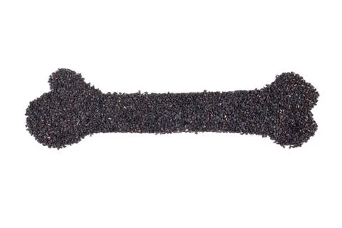 Black sesame in bone shape Stock Photos