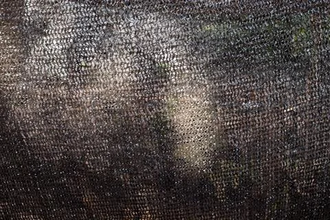 Black Shade Net Mesh Texture Background. woven net mesh texture. Stock Photos