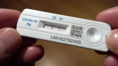 From black shadow to in-focus close-up of a lateral floor test strip, positive. Stock Footage 167313540