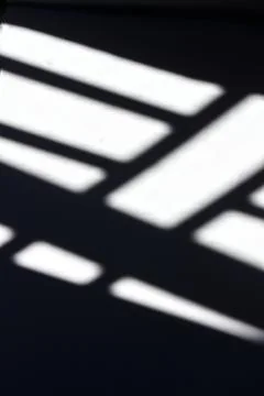 Black shadow of window grille on white background Foto stock