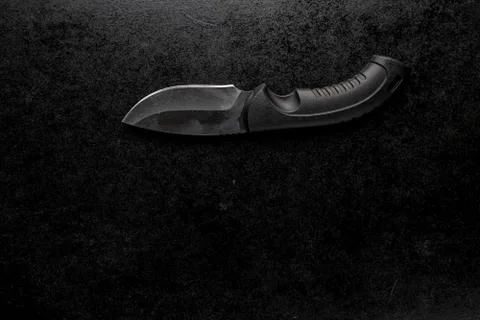 Black sharp small knife with black handle Photos