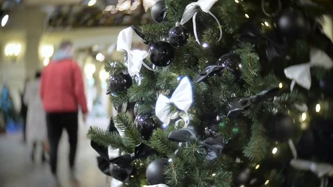 Black shiny and matte balls and white bow. New Year's and abstract blurred Video stock 70656103