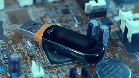 A black shiny usb flash drive lies on the processor of the motherboard  Stock-Footage 130107382