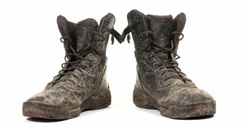 Black shoes, covered in mud Stock Photos