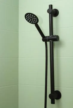 Black shower head close-up, vertical orientation. Heguyna concept Stock Photos