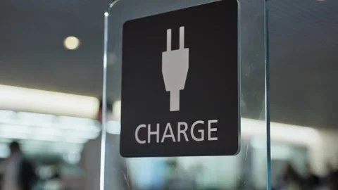 Black sign with plug symbol and word "CHARGE" Video stock 320359820