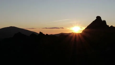 Black silhouette of a mountain at sunset Stock Footage 223481320