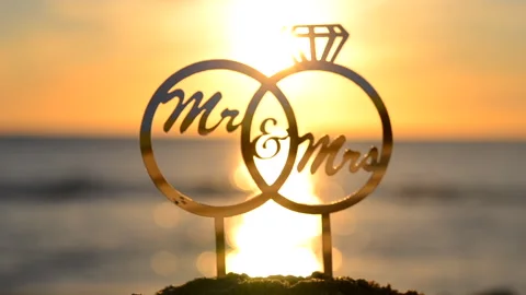 Black silhouette of stick in shape of wedding rings and words Mrs Mr Stock Footage 308184130